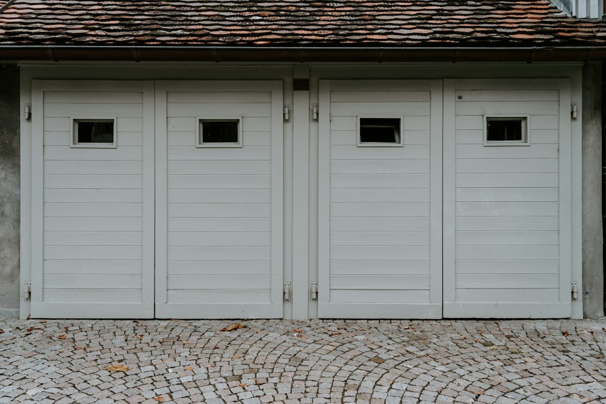 White wooden garage doors with small windows